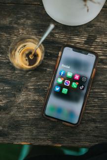 white samsung android smartphone on brown wooden table by Nathan Dumlao courtesy of Unsplash.